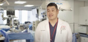 A surgeon from CBD College participating in an interview.
