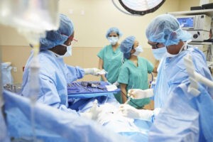 Surgeons performing surgery in an operating room.
