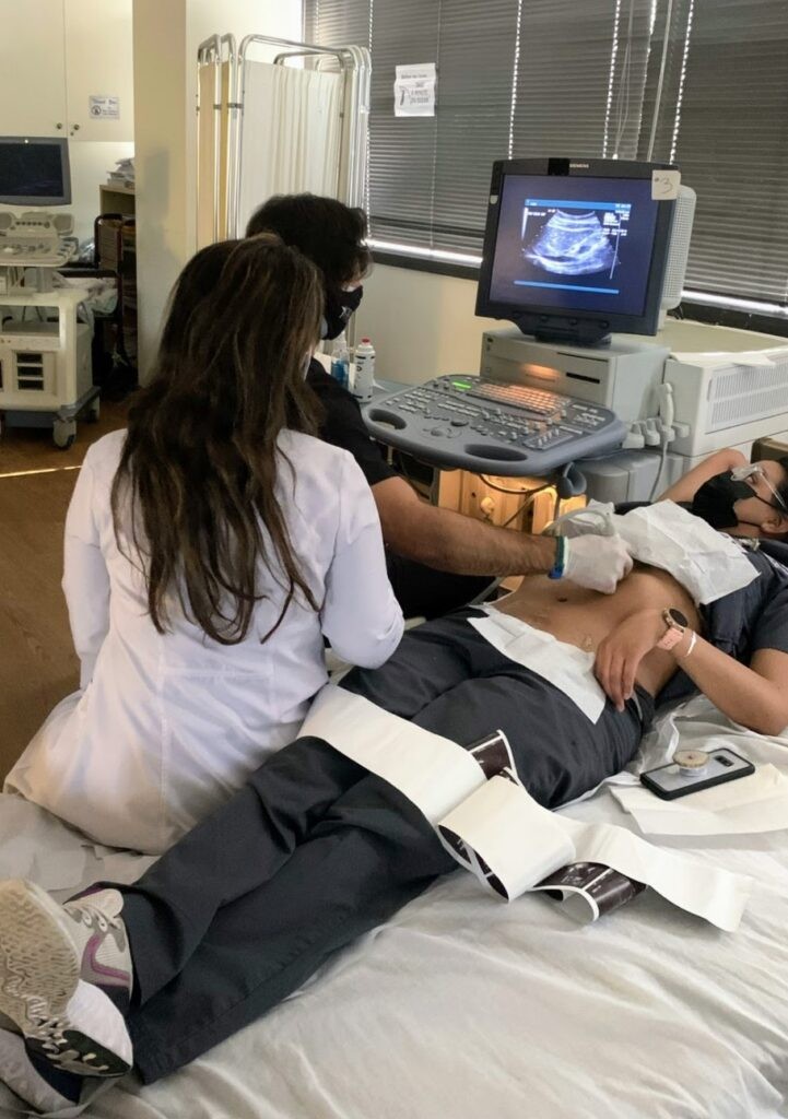 A doctor carefully performs an ultrasound examination of a patient's abdomen, utilizing advanced medical technology to visualize internal structures and assess for any abnormalities. With precision and expertise, the doctor maneuvers the ultrasound probe to capture detailed images, aiding in the diagnosis and treatment of the patient's condition. This non-invasive procedure allows for a thorough assessment of abdominal organs, ensuring comprehensive healthcare delivery.