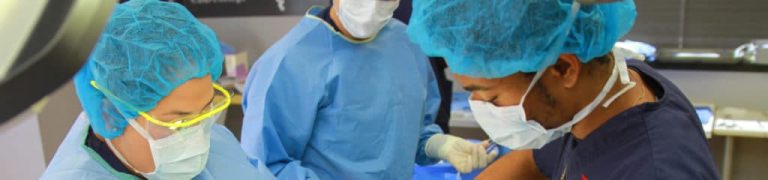 Image of Richard Tovar inside an operating room, demonstrating his role and expertise as a Surgical Technician graduate from CBD College.