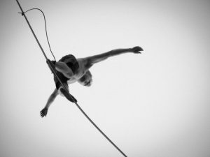 Image featuring a person juggling work, school, and personal life, symbolizing the challenge of balancing multiple responsibilities.
