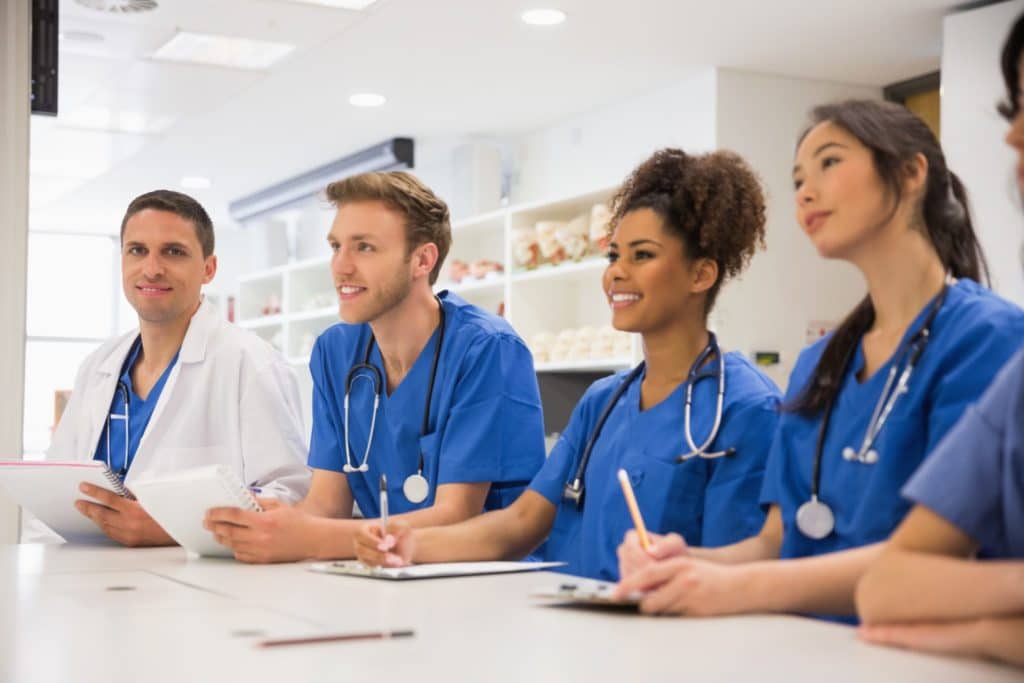 Image showing a group of medical students, engaged in study or discussion, symbolizing collaboration and teamwork in medical education.