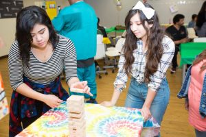 Group of students at CBD College engage in a game, recalling popular 90s pastimes.