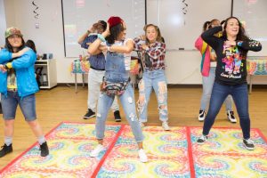 CBD College faculty and students enjoy 90s-inspired music and games during Student Appreciation Day in March 2018.