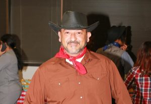 Close-up of students wearing cowboy hats and boots for Western Day at CBD College.