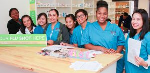Students in the Pharmacy Technician program at CBD College receiving hands-on training in a simulated pharmacy setting.