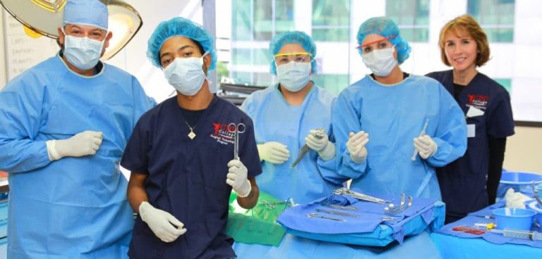 Students and faculty members of the surgical technology program at CBD College gather for a group photo, smiling and celebrating their achievements.