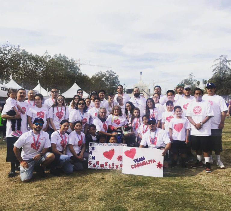 A group of ambassador students wearing ALS awareness shirts, standing in solidarity.
