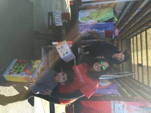 CBD College students distributing toys for charity during the annual toy drive.