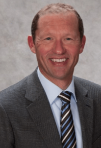 Portrait of Tim Flynn, a respected member of the physical therapy community from Colorado, USA. Tim is a prolific author of textbooks and peer-reviewed manuscripts, and his clinical expertise in pain treatment is recognized nationally and internationally.