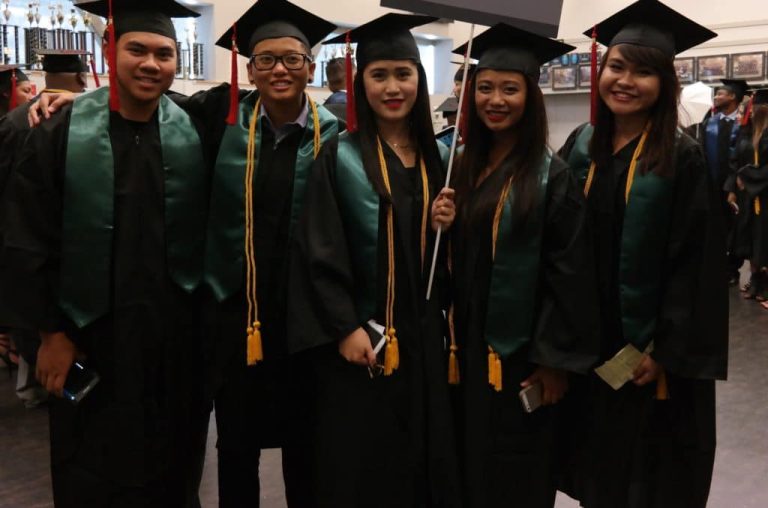 CBD College Winter Graduation Ceremony: Graduates in caps and gowns lining up for procession.