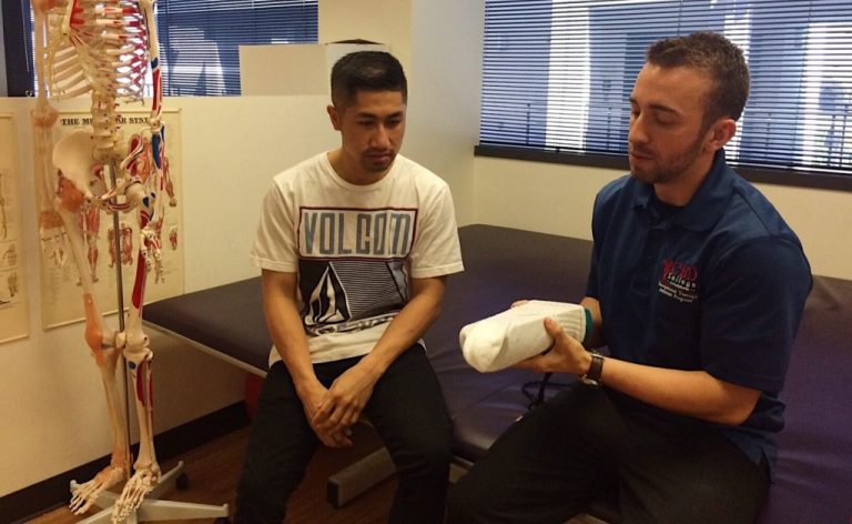Image featuring Jake Argyris, a student at CBD College studying Occupational Therapy, immersed in hands-on training and learning.