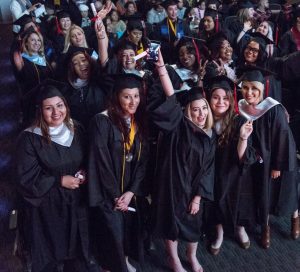 CBD College 2016 Winter Graduation: Group of female graduates proudly celebrating their achievements.