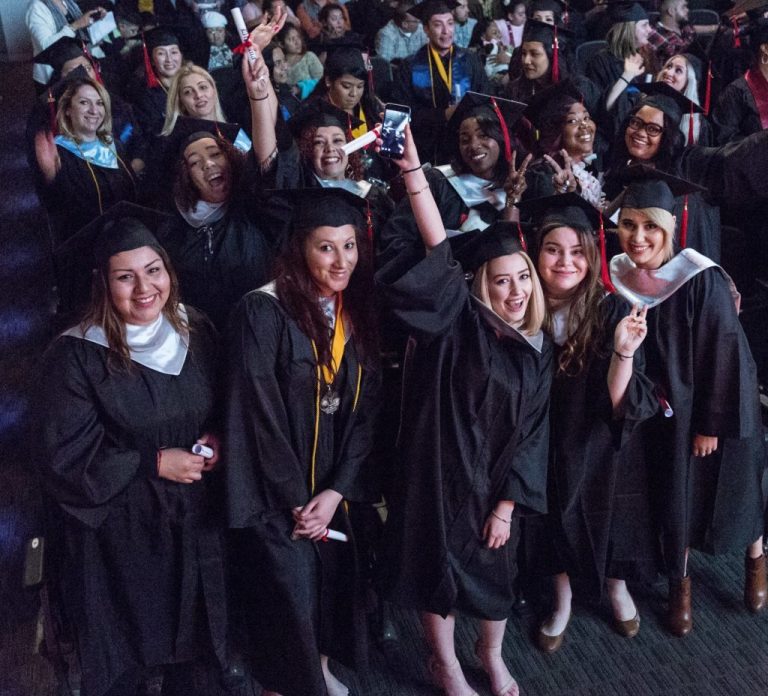 CBD College 2016 Winter Graduation: Group of female graduates proudly celebrating their achievements.