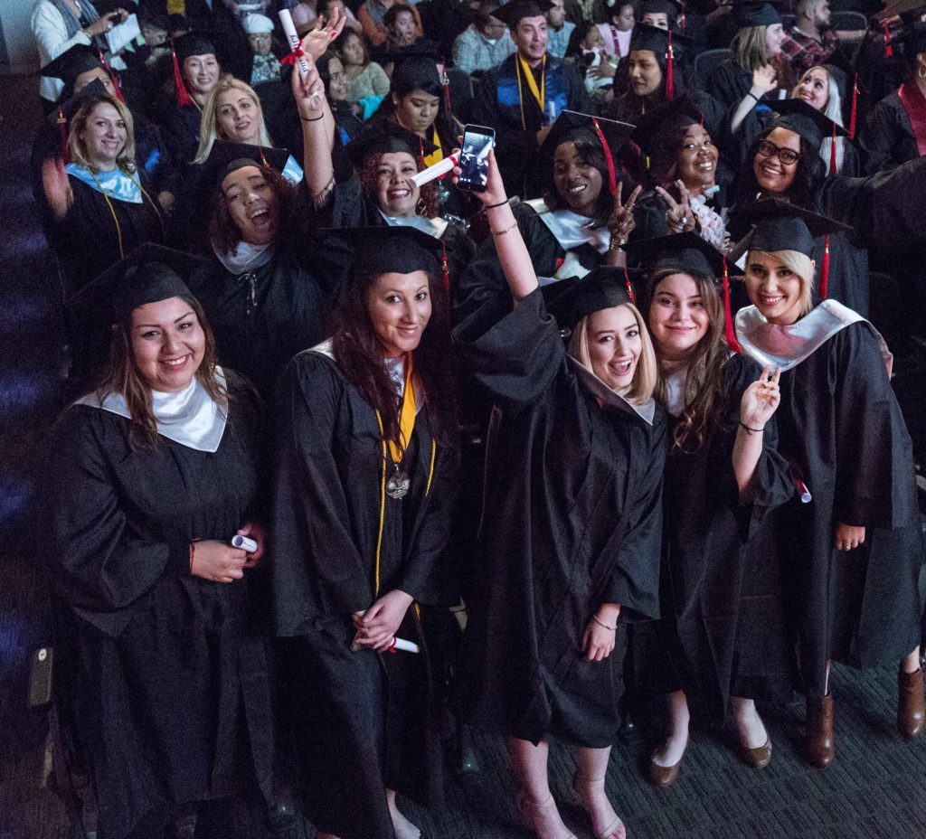 CBD College 2016 Winter Graduation: Group of female graduates proudly celebrating their achievements.