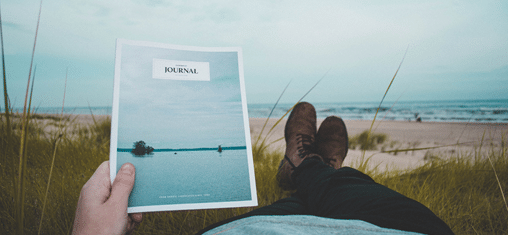 A soothing image of a person taking a leisurely walk along a tranquil beach at sunset, with waves gently lapping at the shore, showcasing the rejuvenating power of connecting with nature as part of self-care practices.