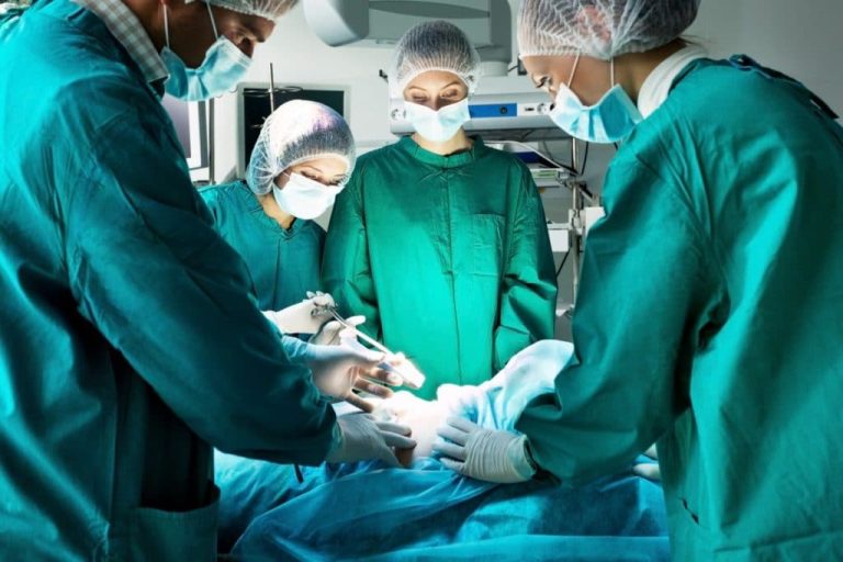 Surgery team operating in a surgical room.