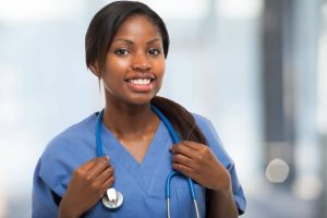 Photograph of a young smiling nurse.