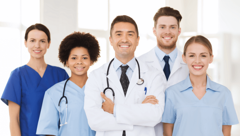 A diverse group of doctors and medical assistants collaborating in a hospital setting, working together to provide quality patient care.