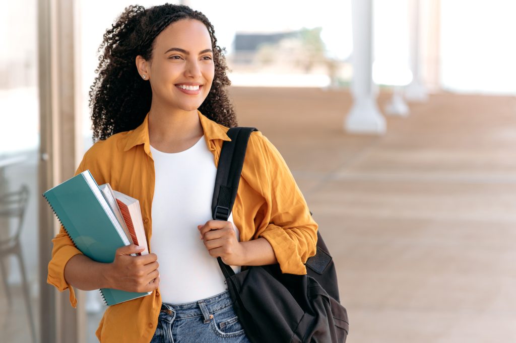 mri technician student walking on campus of a technical school
