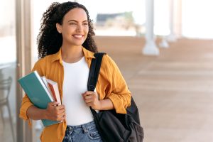 mri technician student walking on campus of a technical school