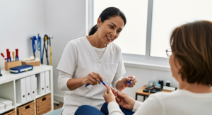 occupational therapist working with patient to improve writing abilities